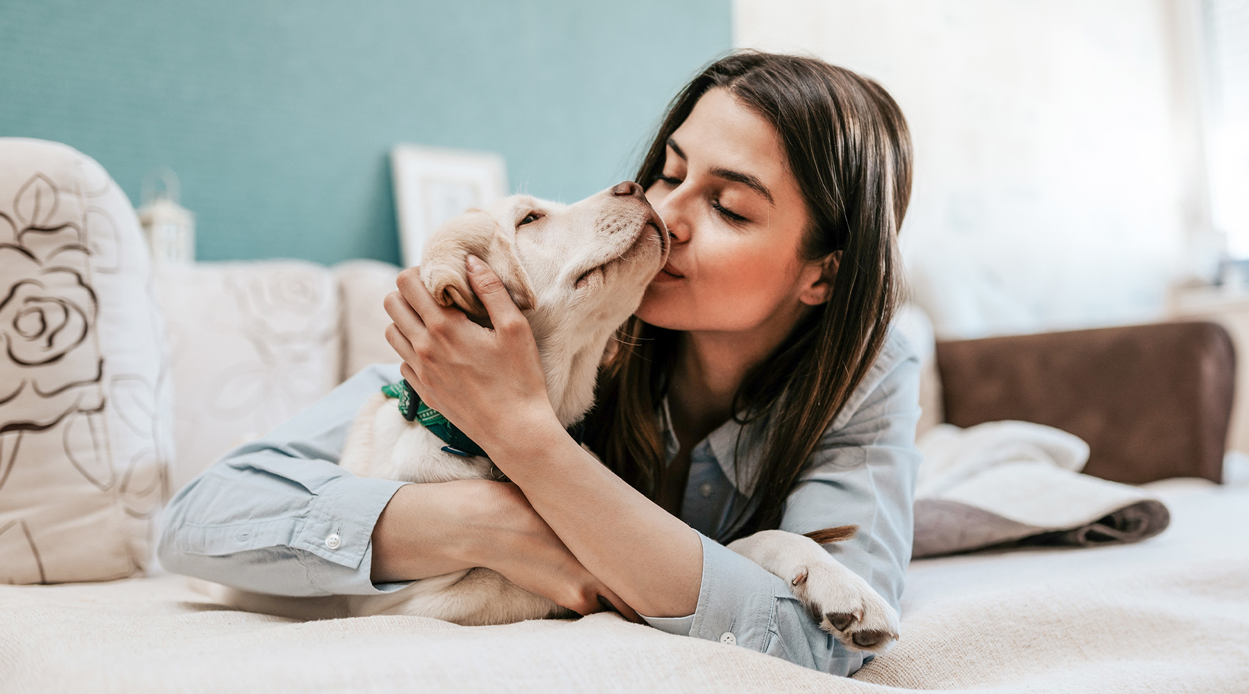 Girl on Bed With Dog