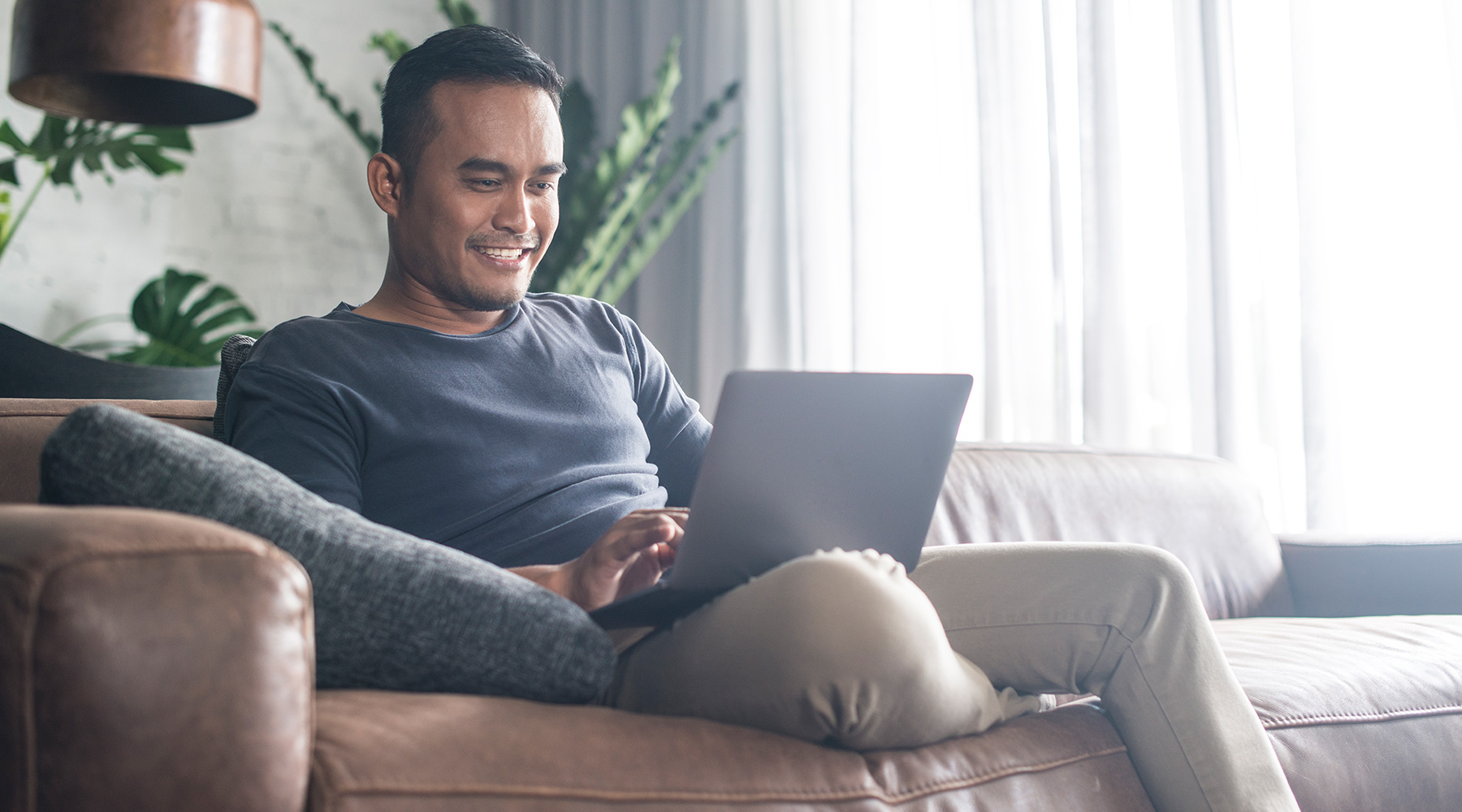 Man on Couch with Computer